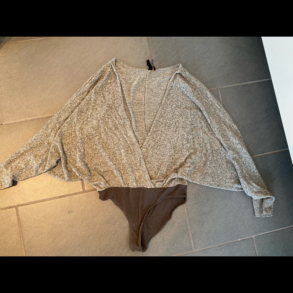 Out from under winged bodysuit